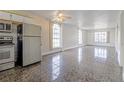 Spacious living room featuring tile flooring, arched windows, and an open layout at 313 Dirksen Dr # G4, Debary, FL 32713