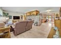 Spacious living room featuring a large brick fireplace and tile flooring at 349 Evansdale Rd, Lake Mary, FL 32746
