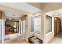 Bright foyer boasting tiled floors, plenty of natural light, and dining area at 411 Columbus Ave, Orange City, FL 32763