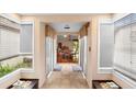 Bright entryway featuring tiled floors, lots of natural light, and dining area access at 411 Columbus Ave, Orange City, FL 32763
