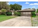 View of the garage and driveway, spacious and perfect for multiple vehicles at 411 Columbus Ave, Orange City, FL 32763