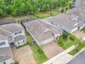 Desirable neighborhood showcasing a home with well-maintained landscaping and a paver driveway at 425 Wedgeworth Ln, Deland, FL 32724