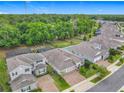 A stunning aerial view shows the home's location within a lush, green community at 425 Wedgeworth Ln, Deland, FL 32724