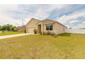 Attractive one-story home with a two-car garage and a manicured front lawn in a residential neighborhood at 4273 Ne 29Th Pl, Ocala, FL 34470
