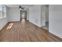 Bright living room featuring stylish wood-look flooring and fresh, white walls at 430 S Woodward Ave, Deland, FL 32720