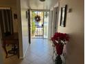 Bright foyer features tile flooring, security door, and seasonal decor, offering a welcoming entrance at 4555 Tower Pine Rd # Ge, Orlando, FL 32839