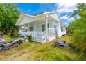 Home with a welcoming porch, featuring neat landscaping and bright, natural light at 5261 3Rd St, Orlando, FL 32810