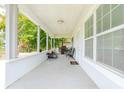 Inviting front porch perfect for relaxing with outdoor seating and a grilling area at 5261 3Rd St, Orlando, FL 32810