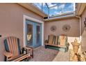 Relaxing screened patio featuring comfortable seating and decorative accents at 5305 Indian Ocean Loop, Tavares, FL 32778