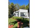 Contemporary home showcases clean lines, lush landscaping, and a welcoming entrance at 736 S Stone St, Deland, FL 32720
