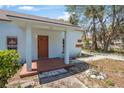 Charming single-story home featuring a cozy front porch and beautifully maintained yard at 742 S Martin Luther King Blvd, Daytona Beach, FL 32114