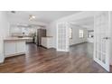 Open kitchen features stainless steel appliances, granite countertops and ample cabinet space at 792 Bennett Rd, South Daytona, FL 32119