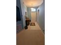 Inviting entryway with tile flooring, and an arched transom window above the front door at 913 Lake Lindley N Dr, Deland, FL 32724