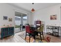 Cozy dining area with sliding glass doors offering plenty of natural light and backyard access at 9392 Revere Ave, Leesburg, FL 34788