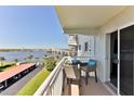 Balcony seating with views of the Halifax River and Daytona Beach bridge at 100 Silver Beach Ave # 716, Daytona Beach, FL 32118