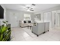 Bright living room featuring neutral tones, tile floors, and open layout at 1044 Deltona Blvd, Deltona, FL 32725