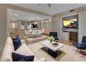Open-concept living room with modern furnishings, a dining area, and stylish decor at 117 N Garfield Ave # 16, Deland, FL 32724
