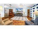 Cozy living room featuring hardwood floors, comfortable seating, and bright natural light, perfect for relaxation at 1426 Saxon Blvd, Deltona, FL 32725