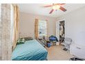 Comfortable bedroom with a cozy bed, ample natural light, and closet space at 1479 Renton St, Deltona, FL 32725