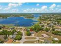 Stunning aerial view of the property near a large lake, showcasing the neighborhood at 2150 Deck Ct, Deltona, FL 32738