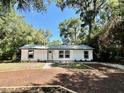 Well-maintained single-story home with tidy landscaping and a welcoming entrance at 249 Citra St, De Leon Springs, FL 32130
