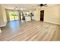 Spacious open-concept living area flows into the kitchen, featuring stylish floors at 249 Citra St, De Leon Springs, FL 32130