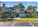 Two-story townhouse showcasing its well-kept exterior and convenient parking spaces at 2704 Lancaster Ct, Apopka, FL 32703