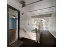 Hallway with stairs and an exit sign, providing access to a unit with wood floors at 2706 Oak Trail Run # 6, Port Orange, FL 32127