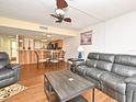 Cozy living room with hardwood floors and an open layout to the kitchen and dining area at 3131 S Ridgewood Ave # 4120, Daytona Beach, FL 32119