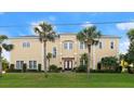 Stately two story home with manicured lawn and palm trees at 3310 John Anderson Dr, Ormond Beach, FL 32176