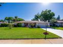 Charming single-story home with a well-maintained lawn, mature trees, and a two-car garage in a desirable location at 3441 Country Walk Dr, Port Orange, FL 32129