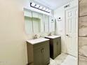 Modern bathroom with double vanities, stylish lighting, and tiled accents at 370 S Center St, Ormond Beach, FL 32174