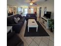 Spacious living room offers tile floors, ample seating, and an inviting atmosphere at 4401 Sea Mist Dr # 201, New Smyrna Beach, FL 32169