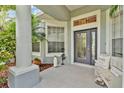 Inviting front porch with decorative accents, creating a warm and welcoming entryway at 483 N Pine Meadow Dr, Debary, FL 32713