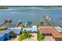 Stunning aerial view of waterfront home with private boat dock and beautiful bay views at 5 Talo Cir, Port Orange, FL 32127