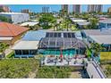 Relaxing deck and screened-in pool area offers the perfect space for entertaining and enjoying the waterfront views at 5 Talo Cir, Port Orange, FL 32127