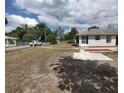 Expansive backyard showcasing a fenced perimeter, creating a private and secure outdoor space at 540 W Mathis Ave, Deland, FL 32720