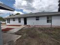 This home shows great curb appeal, with its neutral paint scheme and meticulously landscaped surroundings at 540 W Mathis Ave, Deland, FL 32720