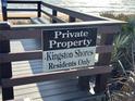 Kingston Shores private beach access sign, with a scenic view of the sandy beach and ocean at 5500 Ocean Shore Blvd # Ut18, Ormond Beach, FL 32176