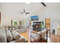 Bright and airy living room with high ceilings, modern fireplace, and comfortable seating at 563 Belltower Ave # 240, Deltona, FL 32725