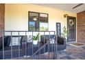 Cozy porch featuring comfortable seating, a welcome sign, and charming floral decorations at 563 Belltower Ave # 240, Deltona, FL 32725