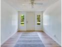 Bright entryway features hardwood floors, white walls, and natural lighting at 607 Herbert St, Port Orange, FL 32129