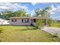 Inviting single-story residence offering a classic façade and a well-kept lawn at 816 W Franklin Ave, Deland, FL 32720
