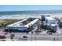 Aerial view showcasing the beachfront condo's proximity to the ocean and surrounding area at 935 S Atlantic Ave # 364, Daytona Beach, FL 32118