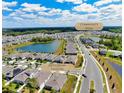 Aerial view of community and the house at 1002 Chelan Falls Dr and community pool at 1002 Chelan Falls Dr, Deland, FL 32724