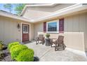 Inviting front porch with seating area, perfect for enjoying the outdoors at 101 Sweetwater Oaks Ln, Daytona Beach, FL 32114