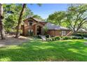 Beautiful brick home featuring manicured landscaping and an inviting entrance at 1081 Torchwood Dr, Deland, FL 32724