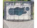 Aerial view of the screened-in pool and jacuzzi, complete with desert landscaping at 112 Coral Reef Ct, Sanford, FL 32771