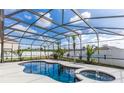 Gorgeous screened-in pool with a jacuzzi and beautiful landscaping at 112 Coral Reef Ct, Sanford, FL 32771