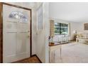 Inviting entryway featuring neutral walls and an entry to the spacious living room at 1128 Heidi Ct, Deland, FL 32720